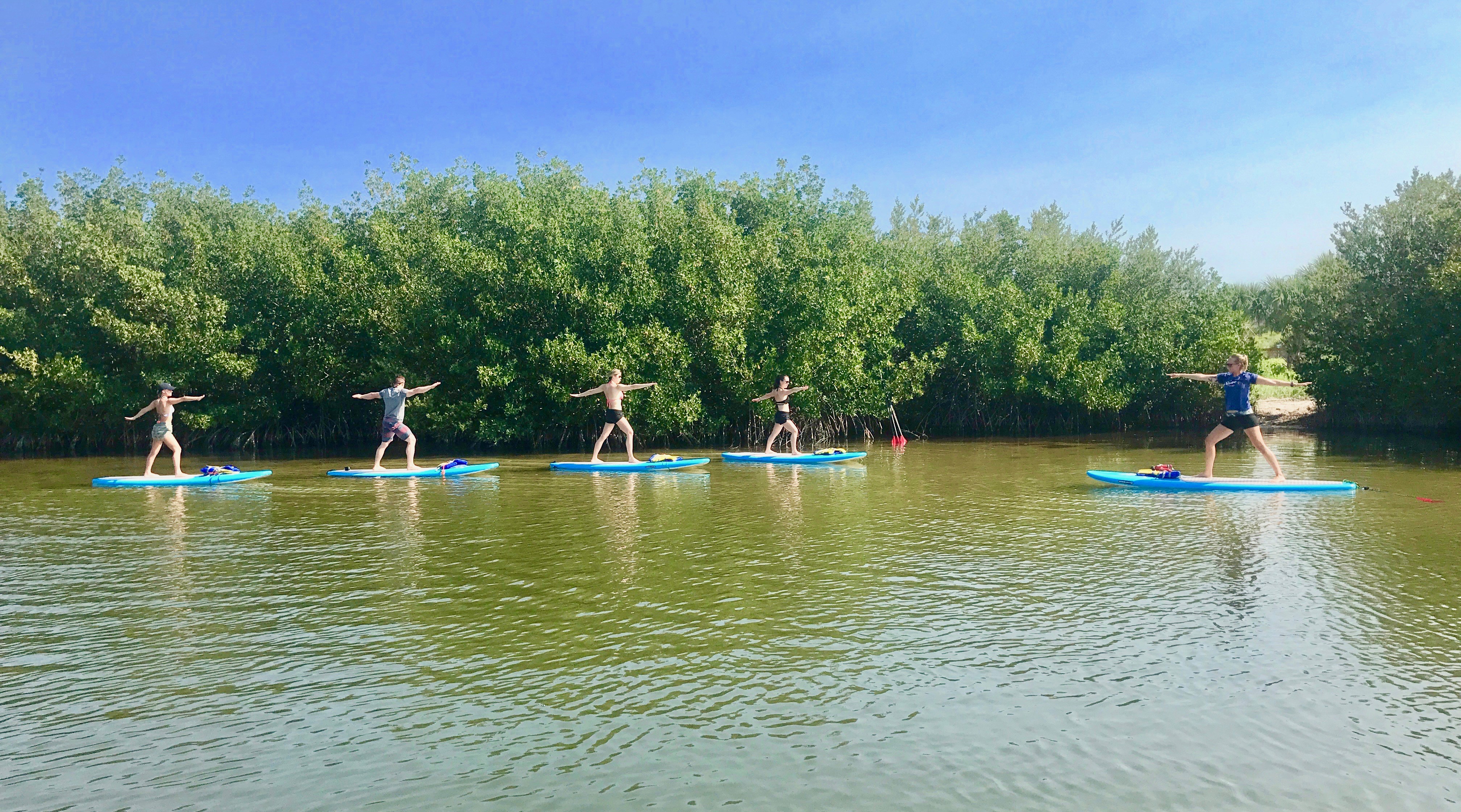 SoBe Surf and Paddle SUP Yoga Class SUP yoga classes near Cocoa Beach, FL