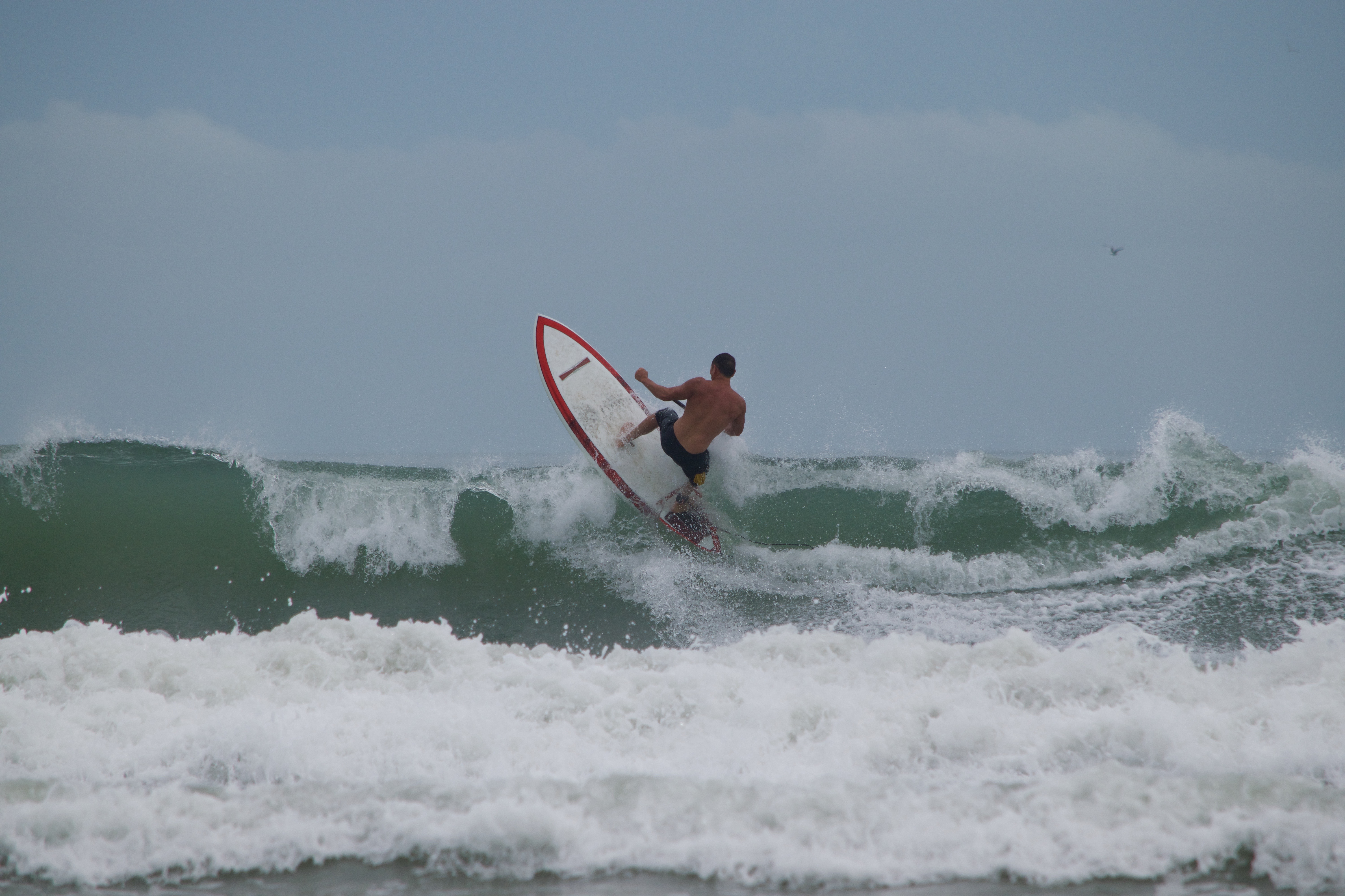 2015-girard-middleton-on-his-first-girard-middleton going vertical sup surfing Girard Middleton Pro Paddle Surfer Surfing in Cocoa Beach owner SoBe Surf and Paddle