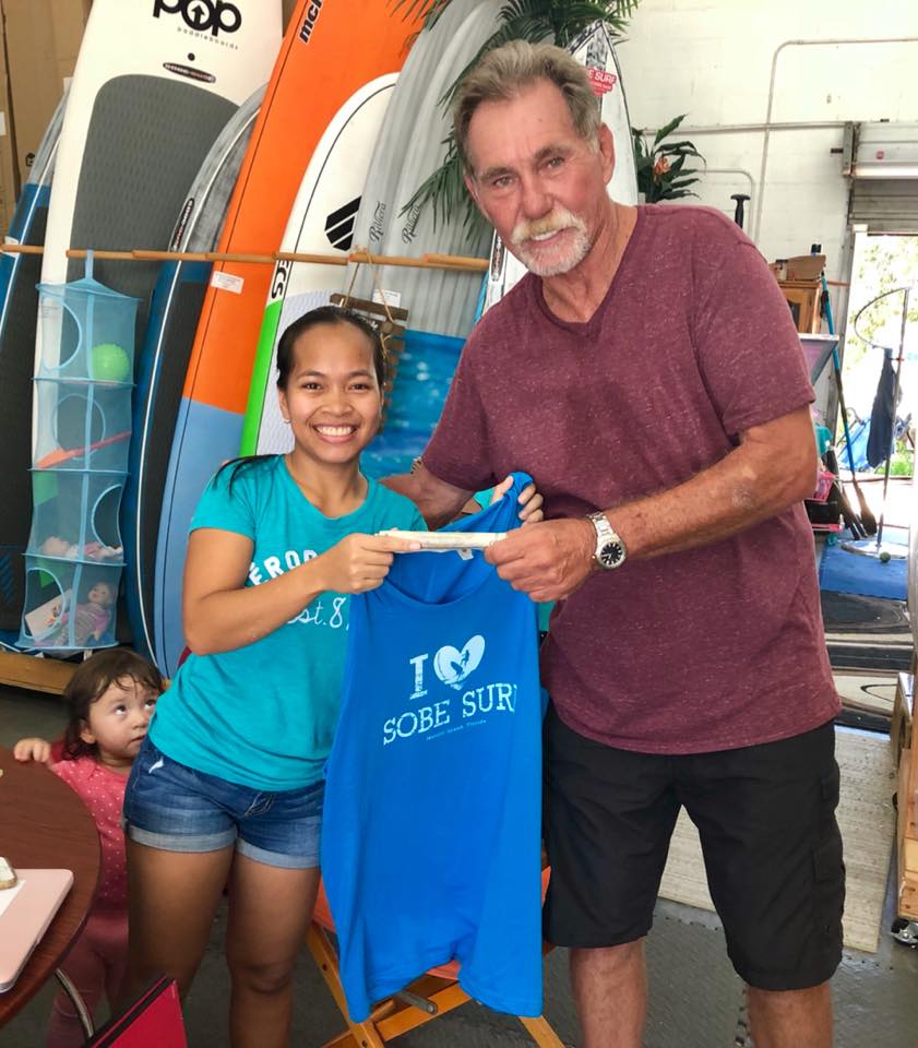 Kristine Middleton selling her first hand made SoBe Surf t-shirt to customer Kristine Middleton selling her first hand made SoBe Surf t-shirt to customer